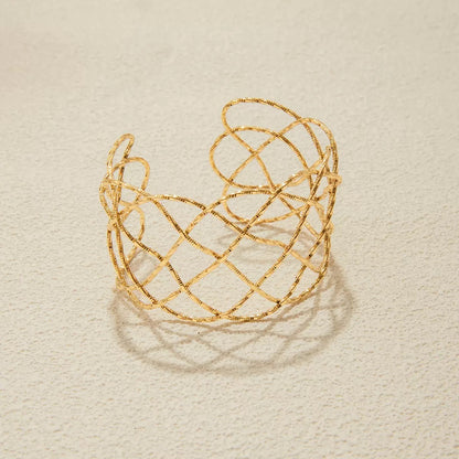 Golden Weave Infinity Statement Cuff